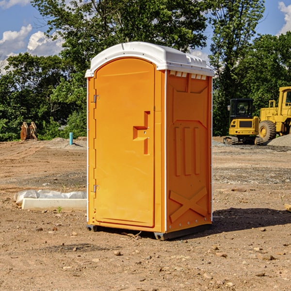 what is the cost difference between standard and deluxe portable restroom rentals in Grandin